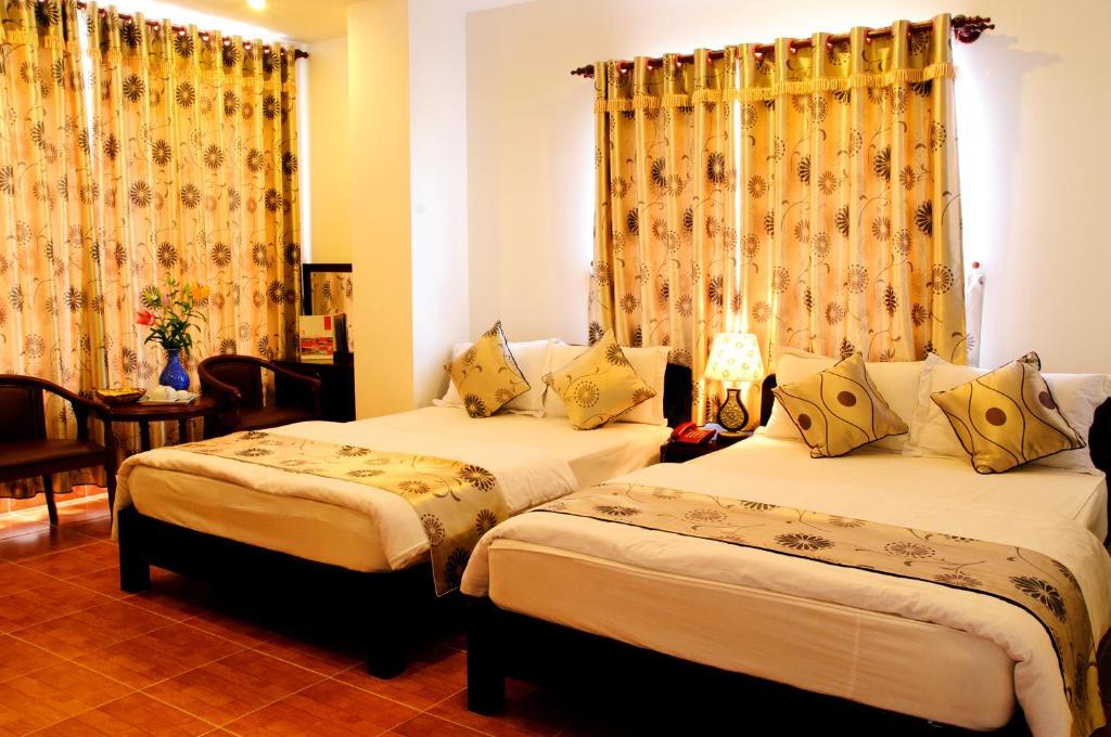 Minh Quan Hotel Bao Loc Quarto foto